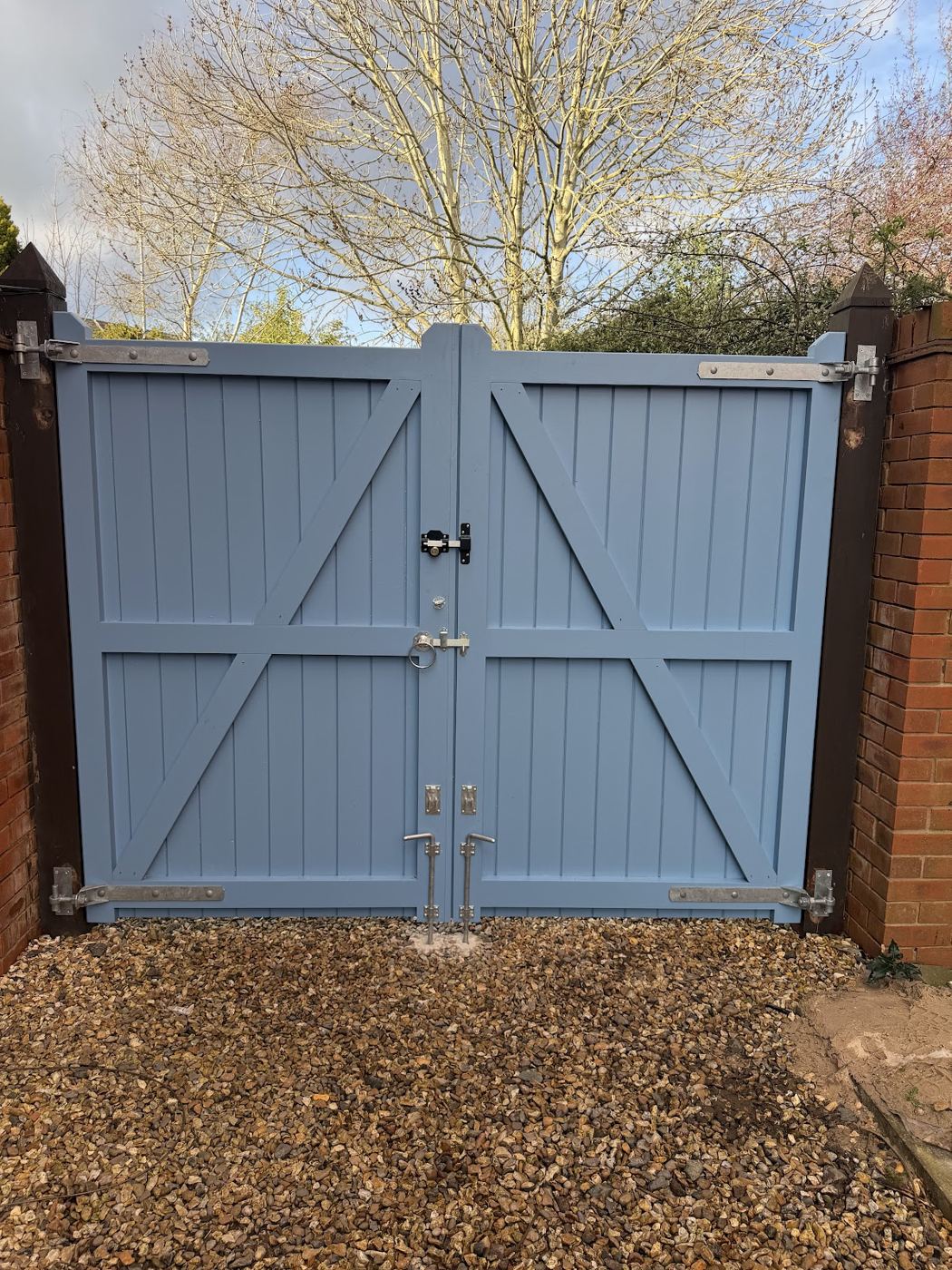 Blue-grey painted double gates with Z braces