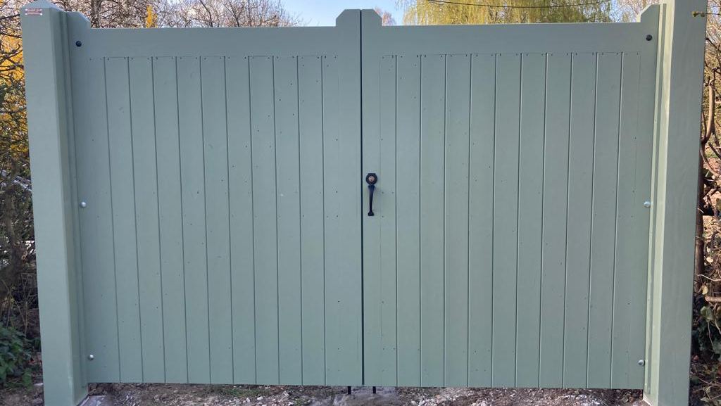 Willow green painted double gates with a black ring handle